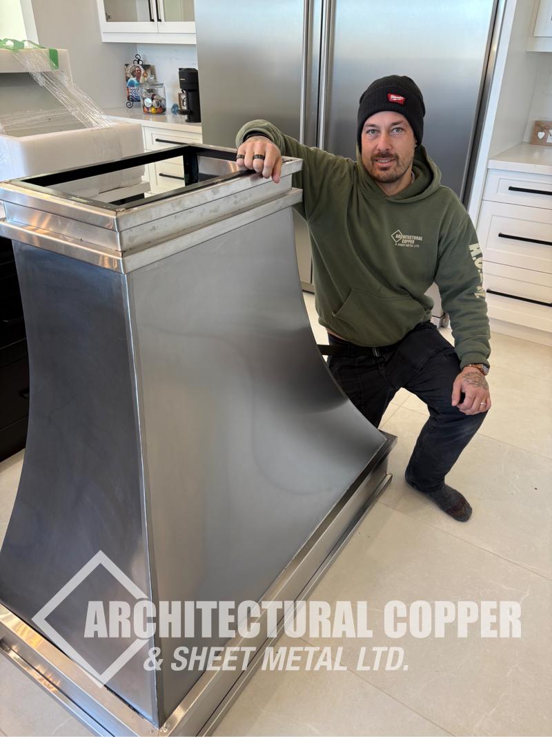 Custom Stainless Steel Range Hood Becomes the Centrepiece of This Fonthill Kitchen